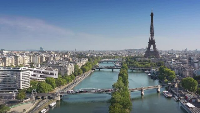 sunny day flight over paris city center famous tower riverside aerial panorama 4k france