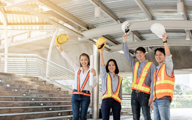 Portrait of engineering group standing near buildings. Construction Concept.