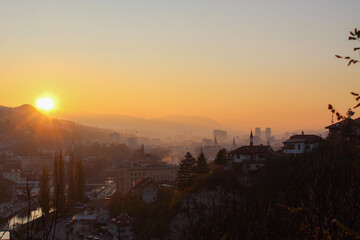 Beautiful sunset over Sarajevo and Sarajevo City Hall. Beautiful view of the city and the silhouettes of other sights of the city of Sarajevo.