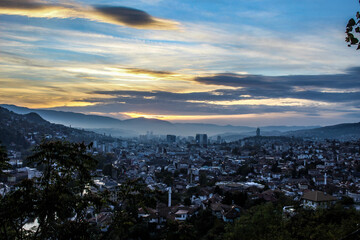 Fototapeta premium Sunset and Sarajevo. Panorama of the city of Sarajevo during sunset. City of Sarajevo.