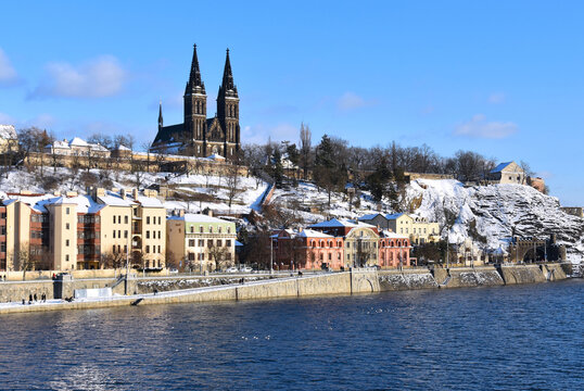 Prague Czech Republic snowy Vysehrad and Vltava river stock images. Winter in Prague city stock photo. Vysehrad church during winter time images. Basilica of St. Peter and Paul in Prague at Vy&scaron;ehrad