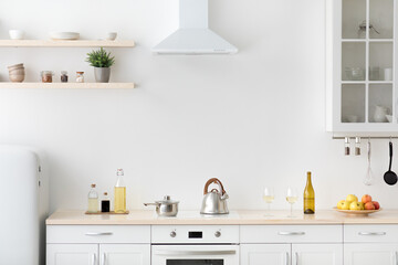 Fototapeta na wymiar Bright kitchen interior in modern apartment for rent, sale and blogging