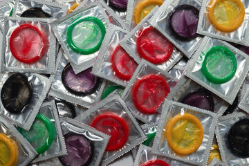 Colorful condoms background.