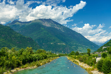 Fototapeta na wymiar The Adda river along the Sentiero della Valtellina at summer
