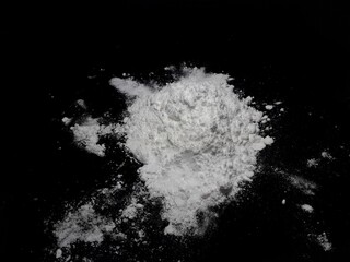 Obraz na płótnie Canvas Cocaine drug powder pile on black background