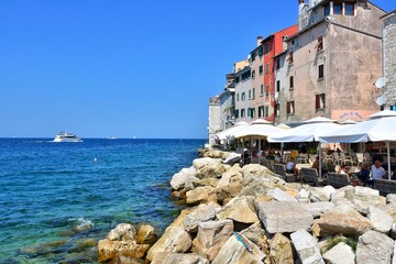 Rovinj, Croatia - August 2020: The old town of Rovinj, a cozy cafe with amazing seaview. Cafe on the Mediterranean coast.