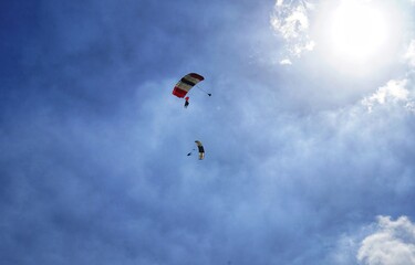 Naklejka na ściany i meble paragliding in the blue sky