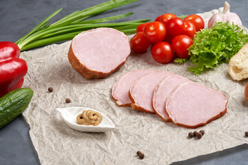 Classic slicing of smoked pork on paper with tomatoes, onions and mustard. Traditional meat products, delicacies.