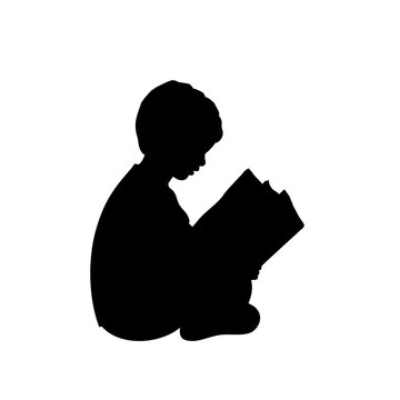 Silhouette baby boy reading book