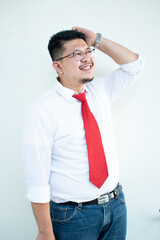 Expert in digital technologies. Cheerful young man in formal wear working on digital tablet and smiling while standing isolated on white background
