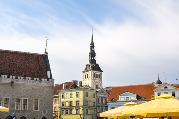 The towers, spires and rooftops of Town Hall square in the medieval city of Tallinn Estonia.