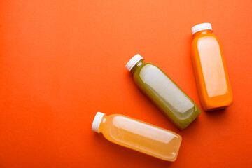 Photo of healthy detox juices over red background, healthy lifestyle, best thing in morning.