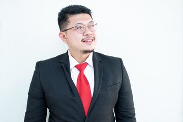 Handsome young business man wear glasses red tie in a suit and west.