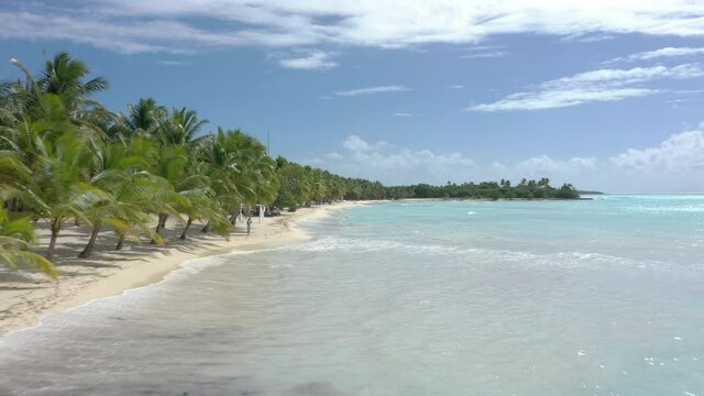A person on a bright beach in Saona Dominican republic holiday from 