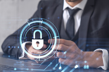 A programmer is browsing the Internet in smart phone to protect a cyber security from hacker attacks and save clients confidential data. Padlock Hologram icons over the typing hands. Formal wear.