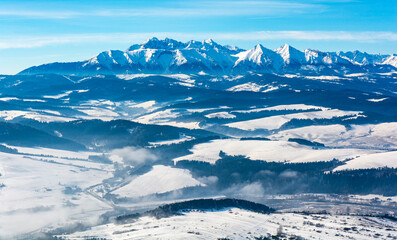 View of the Tatra Mountains in winter colors from the Pieniny Mountains.