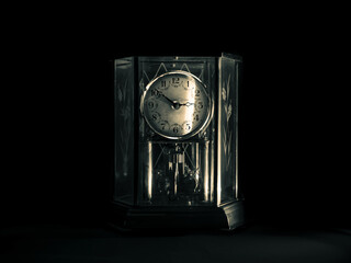old clock on black background