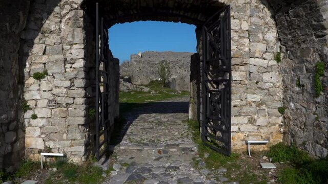 Arched gates and cobblestones inside ancient castle of Rozafa in Albania