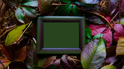 Green copy space in a wooden frame surrounded by colorful autumn leaves. - Powered by Adobe