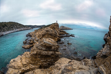 silhouette of a man with a backpack on the mountain