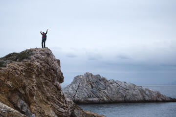 silhouette of a man with a backpack on the mountain