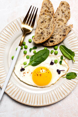 Healthy egg breakfast with spinach and microgreens