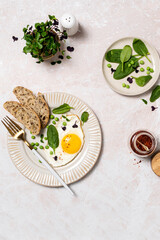 Healthy egg breakfast with spinach and microgreens