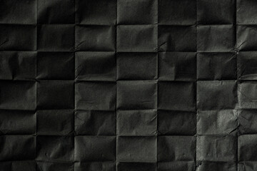 Black paper with folds. Paper texture.