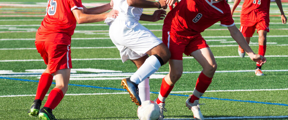 Fototapeta premium Soccer players fighting for the ball