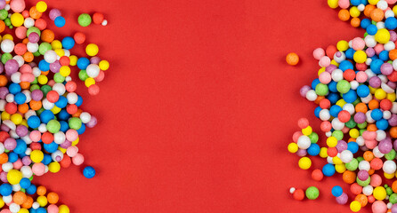 Holiday background, red background with colorful balls