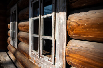 Fototapeta premium Old wooden background. Wooden log house texture