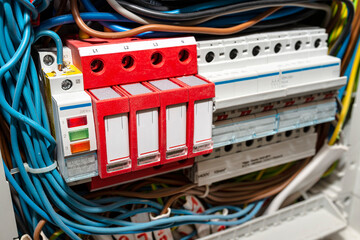 Three-phase fuse in the ON position and surge arrester used to protect the electrical system in the...