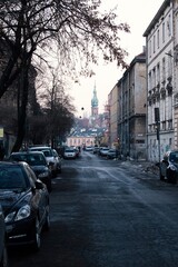 Street with cars, church in background