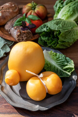 Cheese collection, Italian cheeses provolone, caciocavallo, scamorza made from sheep or cow milk in South Italy, white and yellow smoked.