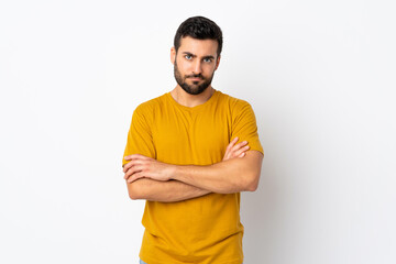Young handsome man with beard isolated on white background feeling upset