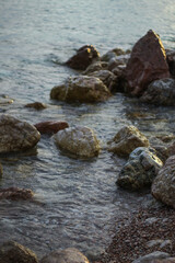 stone beach in the rock. Black Sea. sunset.