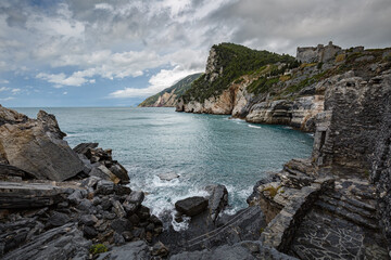 Cliff sea coast with Grotta di Lord Byron in Portovenere or Porto Venere town on Ligurian coast. Province of La Spezia. Italy