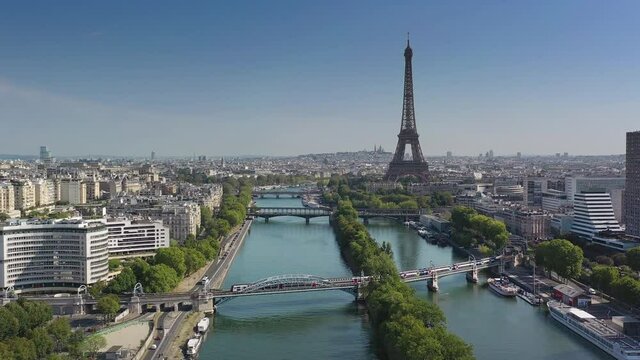 sunny day paris city famous central river traffic bridges tower district aerial panorama 4k france