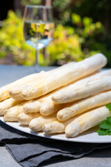 Dutch farmers products, fresh white asparagus and glass of white wine  in spring season