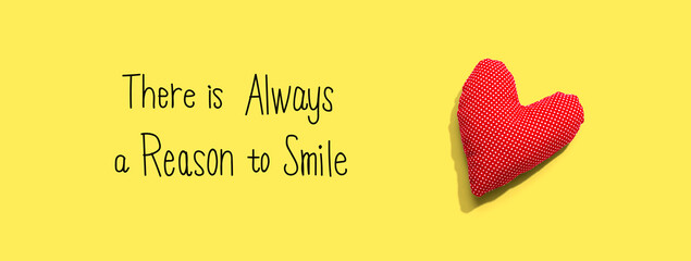 There is always a reason to smile with a red heart cushion - flat lay