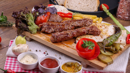 grilled kebab with fried potatoes and rice
