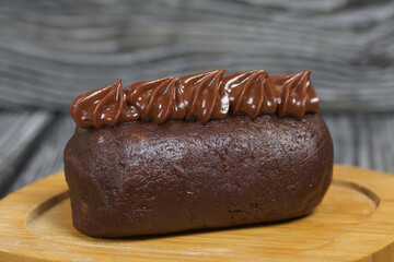 Potato cake. Decorated with chocolate cream.