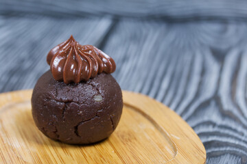 Potato cake. Decorated with chocolate cream.