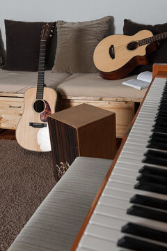 guitar and piano keys with cajon