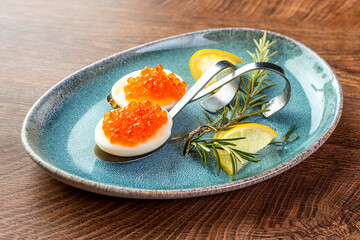 Russian cuisine. Red caviar and eggs