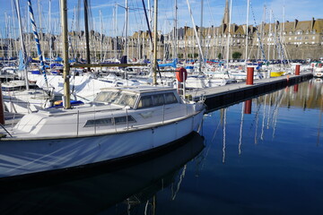 boats in marina in front of old town and ramparts of St Malo, Brittany, France