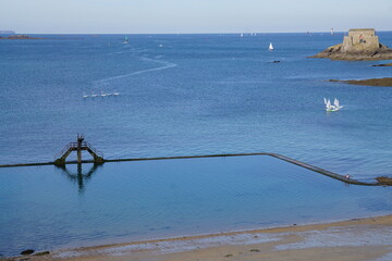natural ocean pool with diving board on the beach of St Malo, Brittany, France