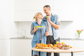 couple cooking healthy food in kitchen lifestyle meal preparation