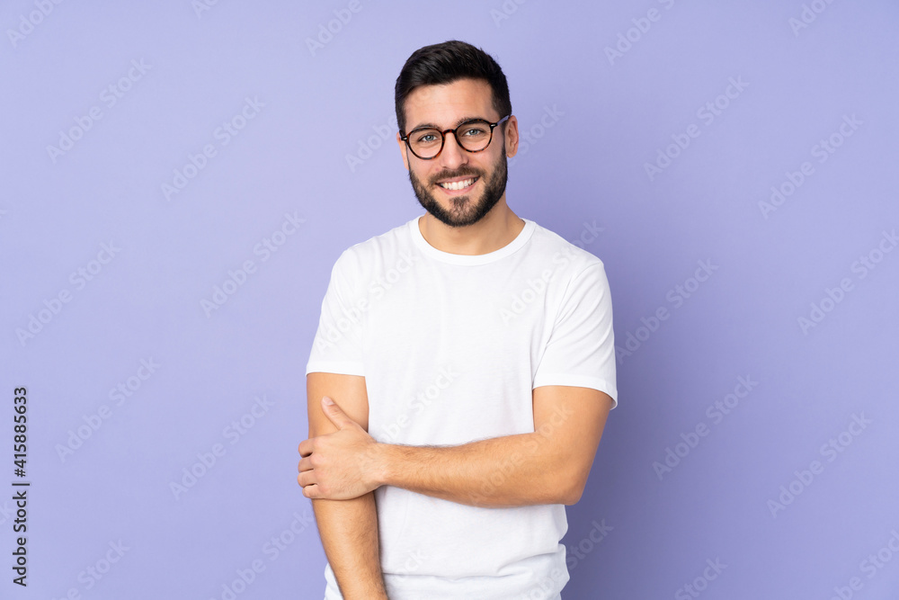 Wall mural caucasian handsome man over isolated background laughing