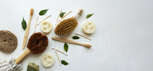 The concept of zero waste. Eco-friendly personal care and home cleaning items on a white background with space for text.